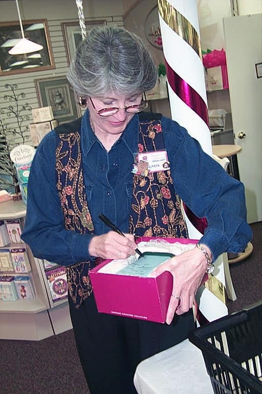 Linda Sickman signing.